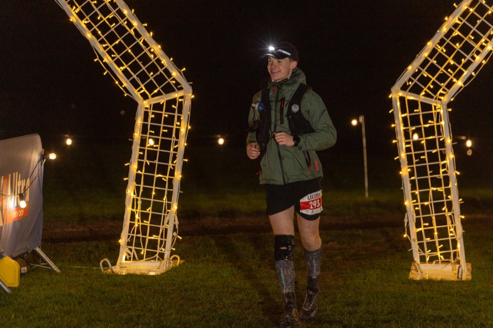 Louis running an ultra at night, headlamp on